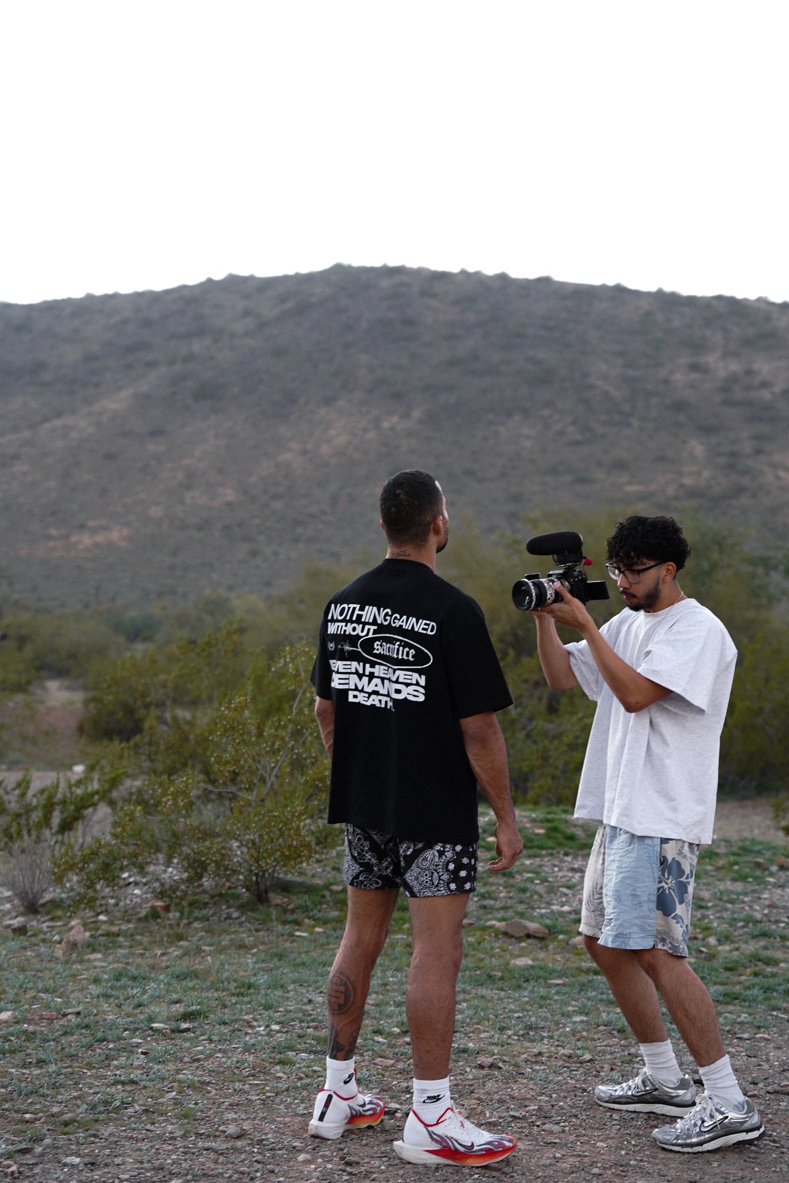 Videographer filming a Mentality athlete outdoors